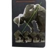 Embroidery art on small black notebook, collage of man picking something from rows of tiny houses