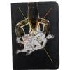 Embroidery art on small black notebook, collage of lobster holding woman in dress