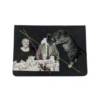 Embroidery art on small black notebook, collage of cat drinking from neck of man sitting to dinner with wife