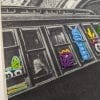 Embroidery art, threaded monsters on black and white photo of subway train