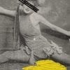 Embroidery Art, threaded yellow puddle on black and white photo of woman doing the splits