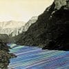 Embroidery Art, neon green purple and blue threaded river between mountains black and white photo