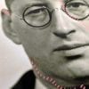 Embroidery art on black and white photo, threaded hot pink pocket and details on portrait of man in glasses