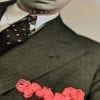 Embroidery art on black and white photo, threaded hot pink pocket and details on portrait of man in glasses