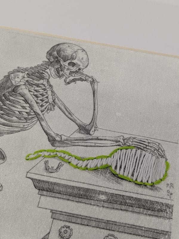 Embroidery Art, green thread on black and white drawing of skeleton