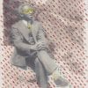 Embroidery art, yellow thread sunglasses and sprinkle rain on black and white photo of man sitting on a rock
