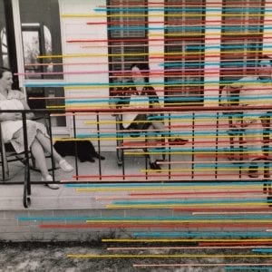 Embroidery art, multicolored thread lines on black and white photo
