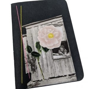 Pocket size black notebook with collage of photos and thread, woman looks out of window at oversized flower
