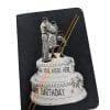 Pocket size black notebook with collage of family walking on top of cake