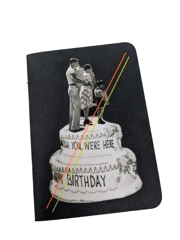 Pocket size black notebook with collage of family walking on top of cake
