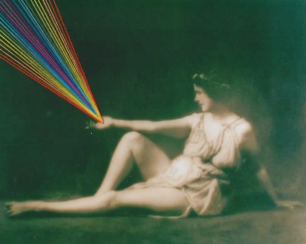 Black and white photo of Isodora Duncan with rainbow thread coming from her open palm
